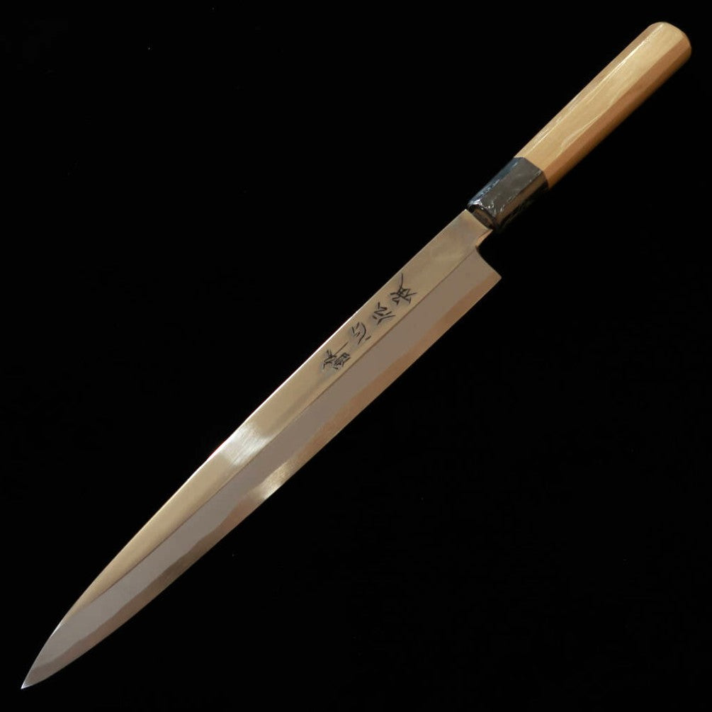 Suisin SUISIN Denshou Forjada por Kenji Togashi Yanagiba para canhotos Aço Shirogami #1 Acabamento espelhado Cabo octogonal de magnólia Com bainha de magnólia (270 mm)