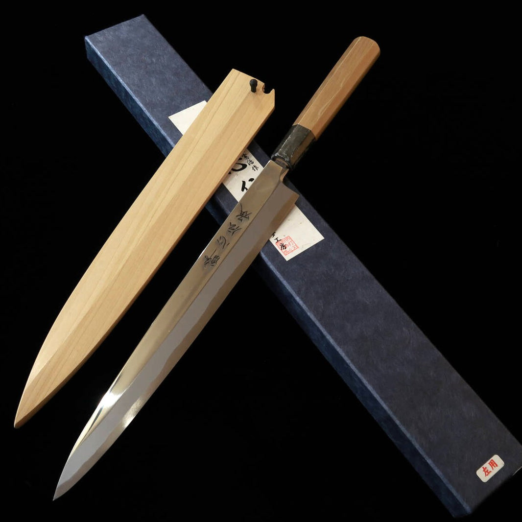 Suisin SUISIN Denshou Forjada por Kenji Togashi Yanagiba para canhotos Aço Shirogami #1 Acabamento espelhado Cabo octogonal de magnólia Com bainha de magnólia (270 mm)