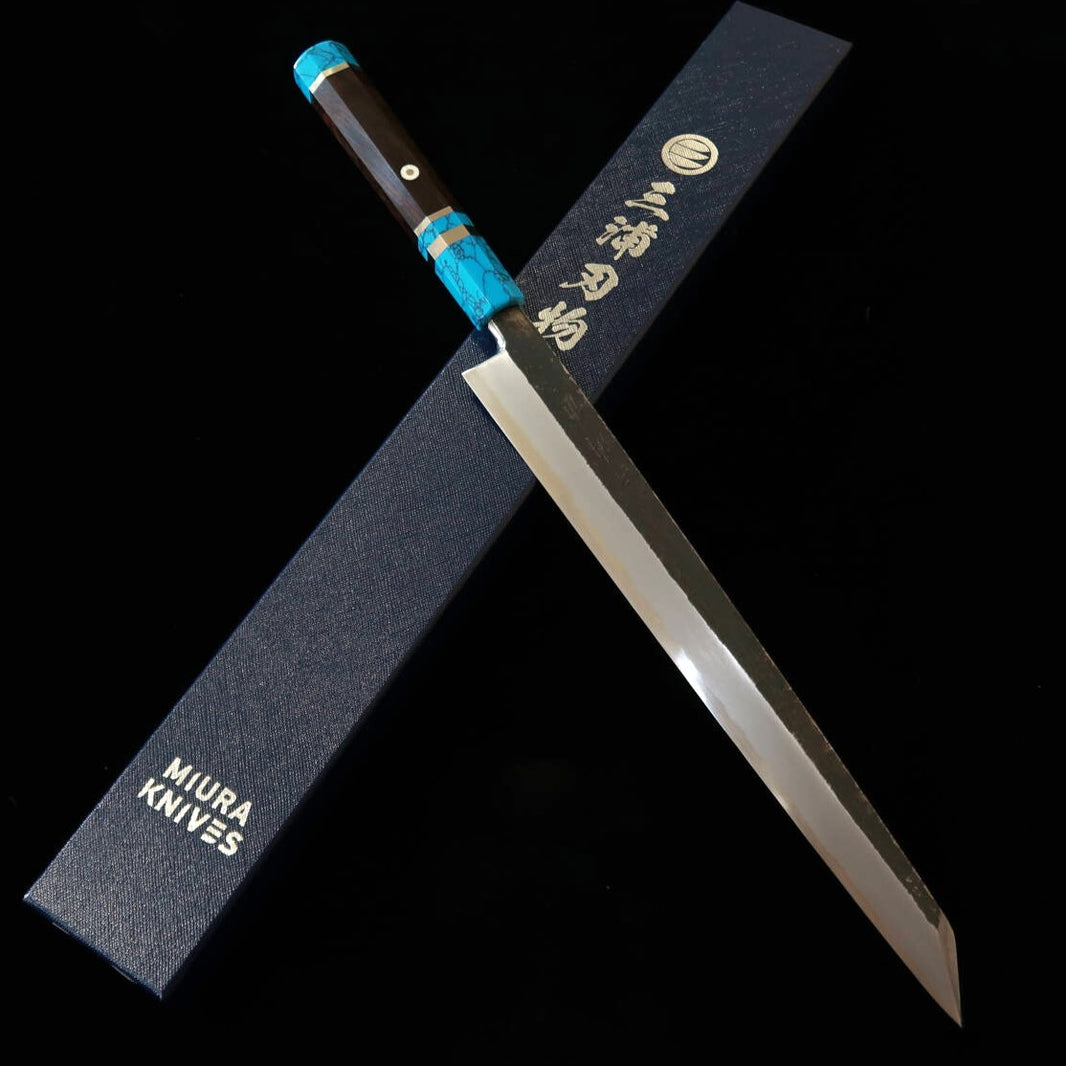 Miura Itadaki MIURA Itadaki por Yoshikazu Tanaka, yanagiba kiritsuke, aço branco #2, kuro-uchi, cabo em turquesa preta (300 mm)