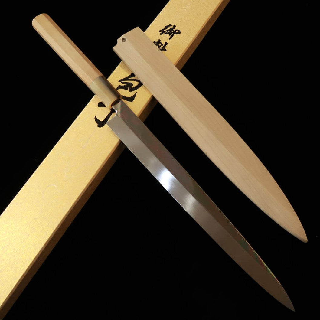 Gō Umanosuke Yoshihiro YOSHIHIRO Faca para fugu Hakushi Nº2 Mizuhonyaki Acabamento espelhado com padrão de onda Cabo branco em magnólia com saya de magnólia (240–300 mm)